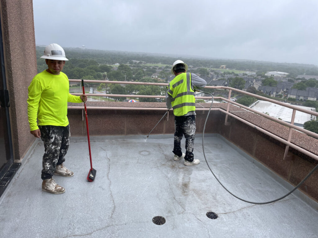 Resurfaced concrete balcony with high-solids silicone coating and ceramic granules on Arlington high-rise by Pepper Coatings