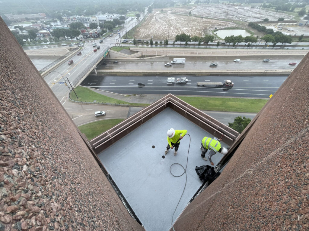 Resurfaced concrete balcony with high-solids silicone coating and ceramic granules on Arlington high-rise by Pepper Coatings