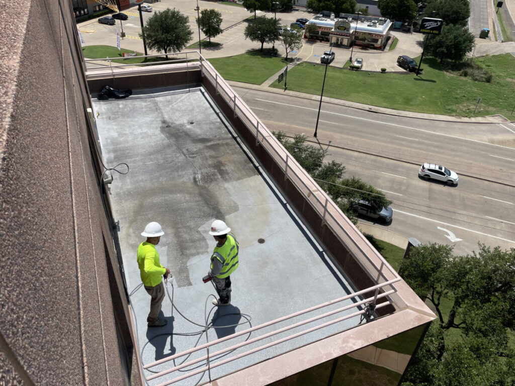 Resurfaced concrete balcony with high-solids silicone coating and ceramic granules on Arlington high-rise by Pepper Coatings