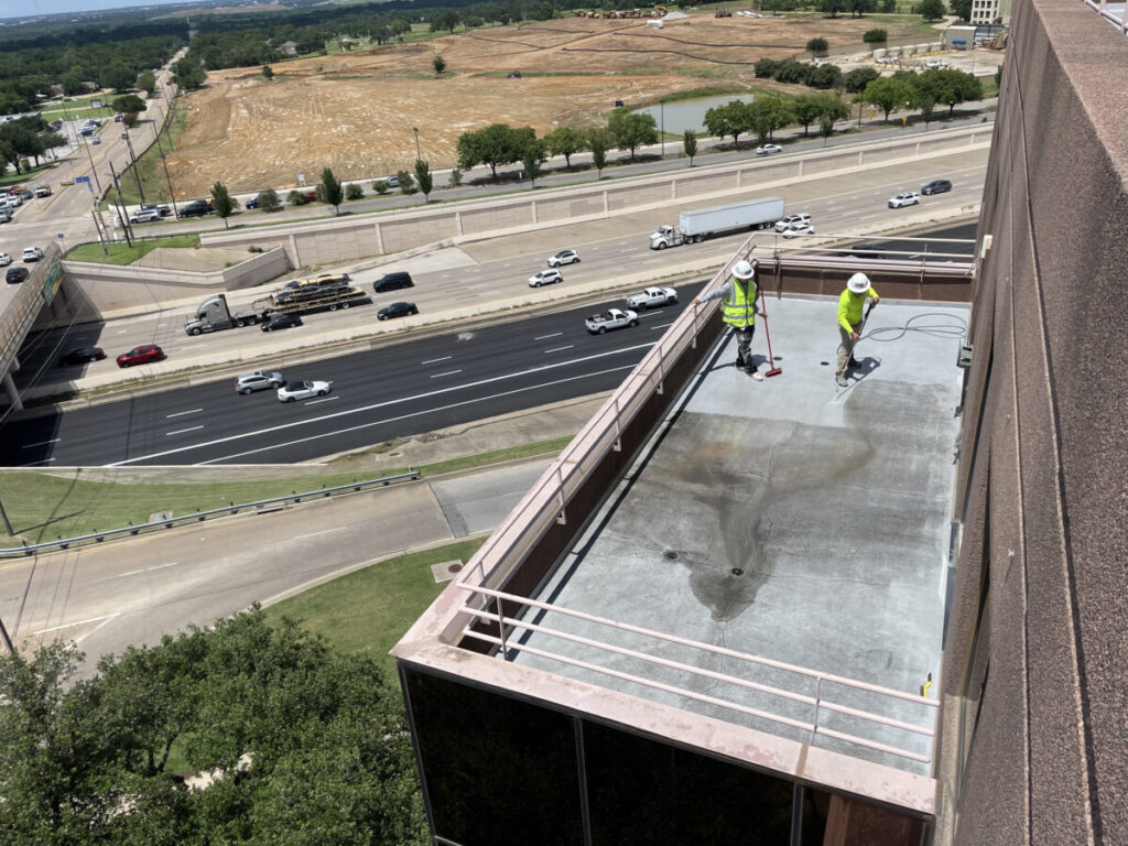 Resurfaced concrete balcony with high-solids silicone coating and ceramic granules on Arlington high-rise by Pepper Coatings