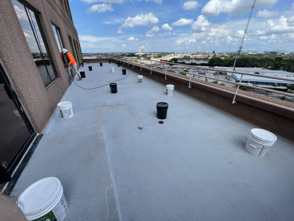 Resurfaced concrete balcony with high-solids silicone coating and ceramic granules on Arlington high-rise by Pepper Coatings