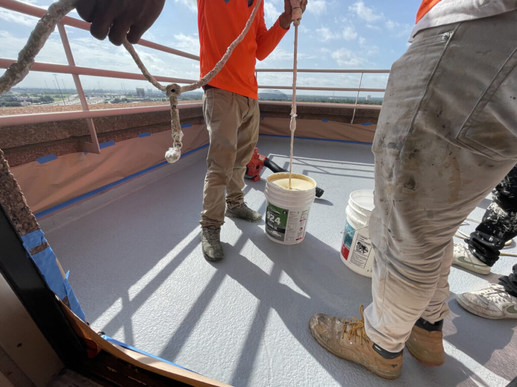 Resurfaced concrete balcony with high-solids silicone coating and ceramic granules on Arlington high-rise by Pepper Coatings
