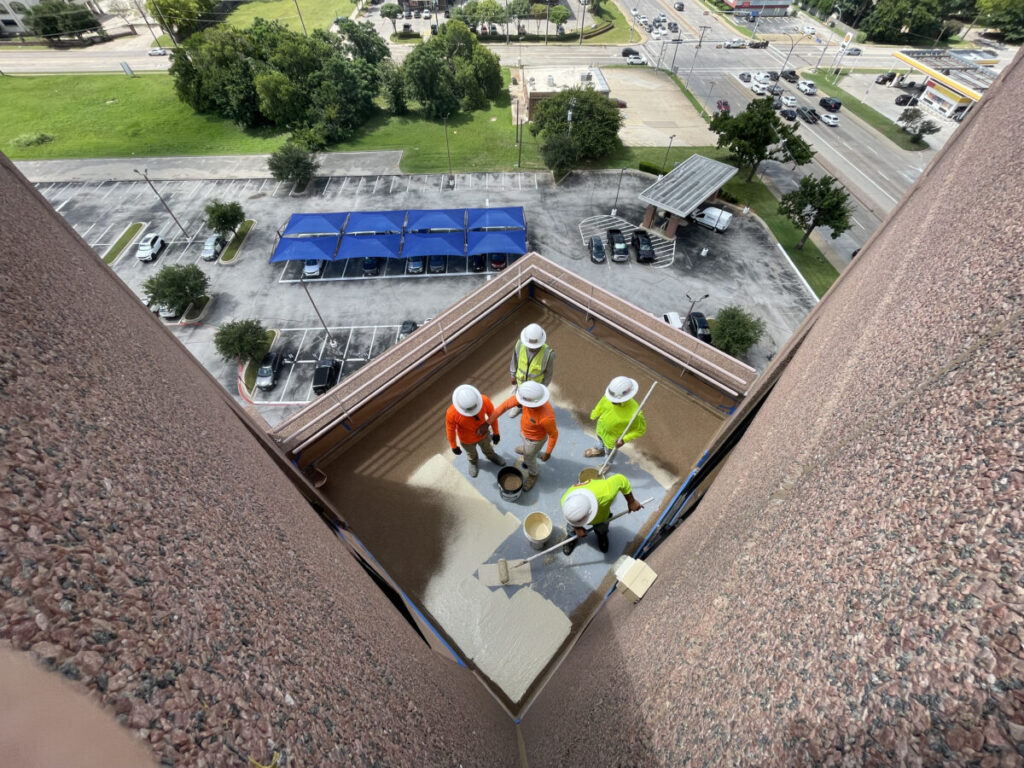 Resurfaced concrete balcony with high-solids silicone coating and ceramic granules on Arlington high-rise by Pepper Coatings