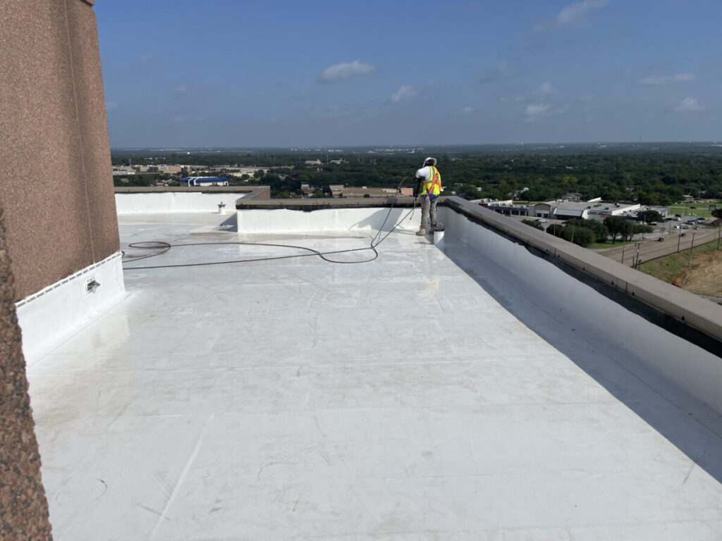 Resurfaced concrete balcony with high-solids silicone coating and ceramic granules on Arlington high-rise by Pepper Coatings