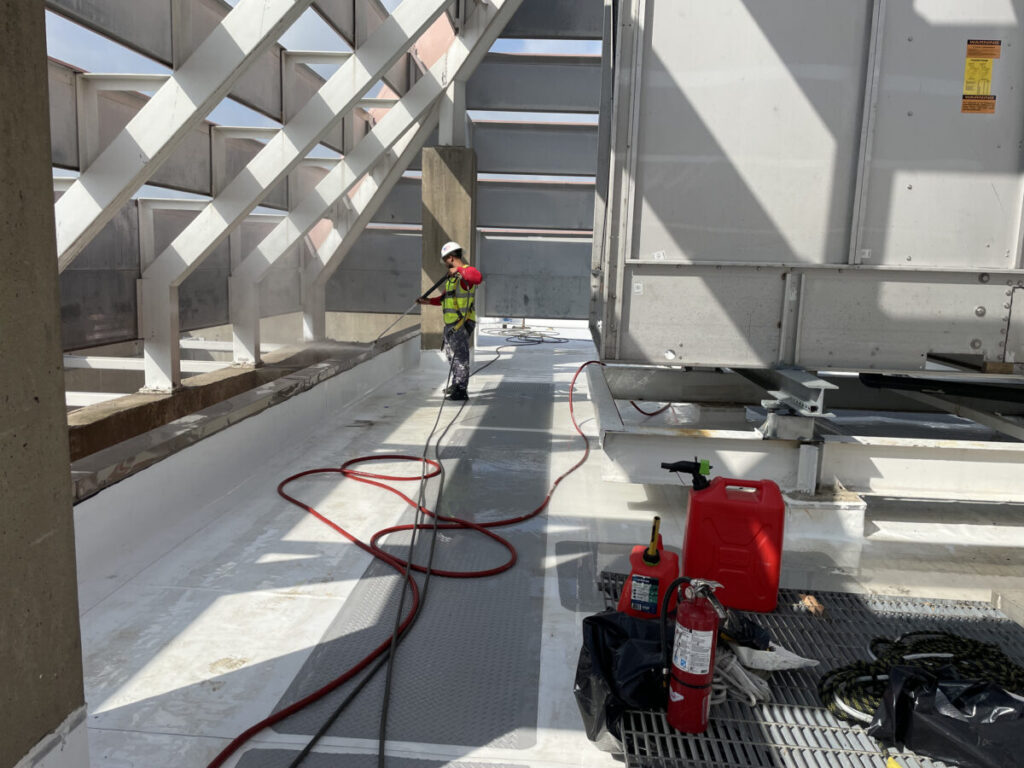 Resurfaced concrete balcony with high-solids silicone coating and ceramic granules on Arlington high-rise by Pepper Coatings