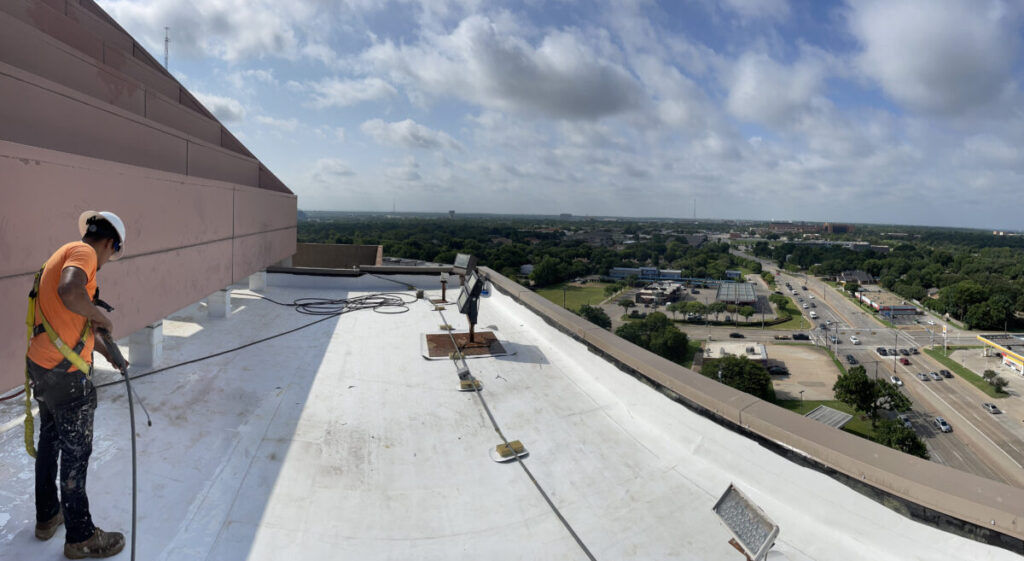 Resurfaced concrete balcony with high-solids silicone coating and ceramic granules on Arlington high-rise by Pepper Coatings