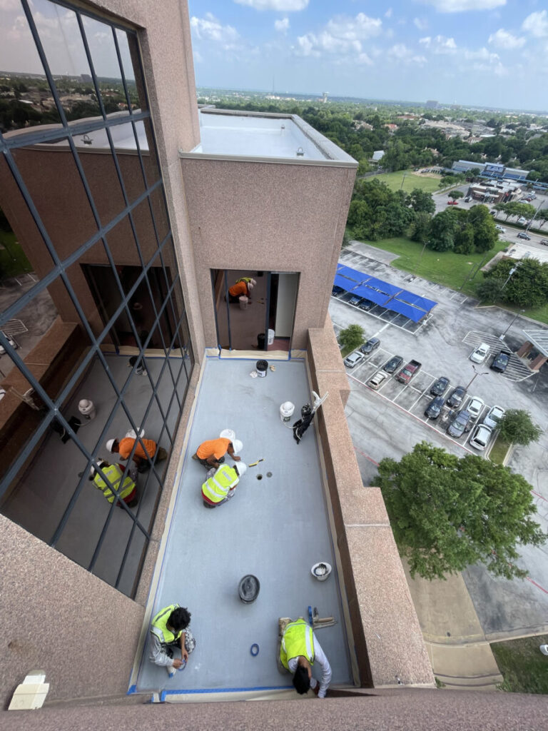 Resurfaced concrete balcony with high-solids silicone coating and ceramic granules on Arlington high-rise by Pepper Coatings