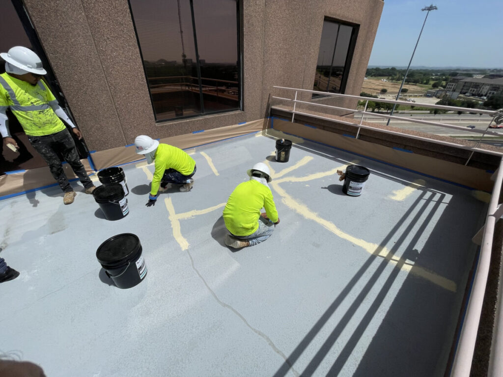Resurfaced concrete balcony with high-solids silicone coating and ceramic granules on Arlington high-rise by Pepper Coatings
