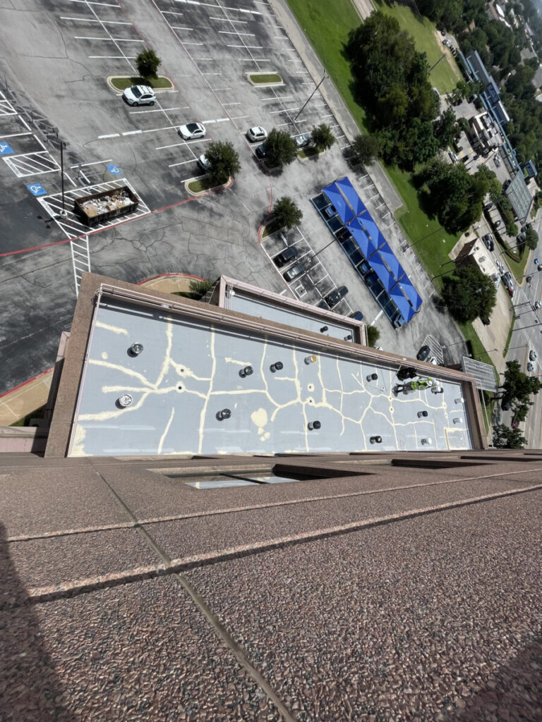 Resurfaced concrete balcony with high-solids silicone coating and ceramic granules on Arlington high-rise by Pepper Coatings