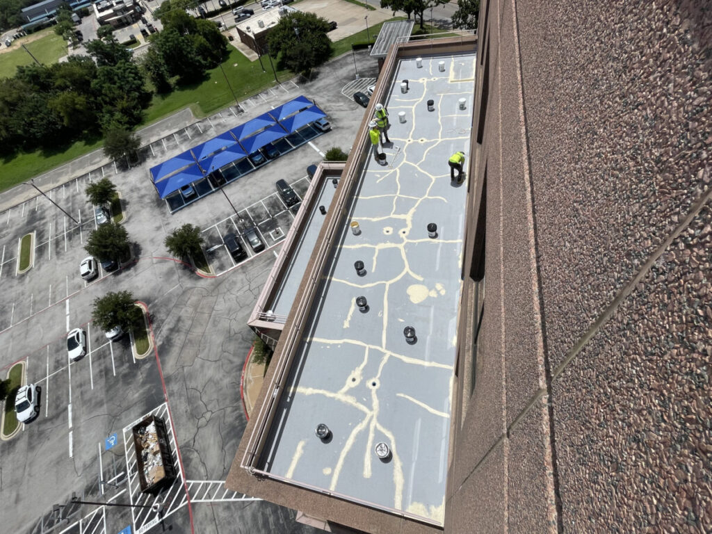 Resurfaced concrete balcony with high-solids silicone coating and ceramic granules on Arlington high-rise by Pepper Coatings
