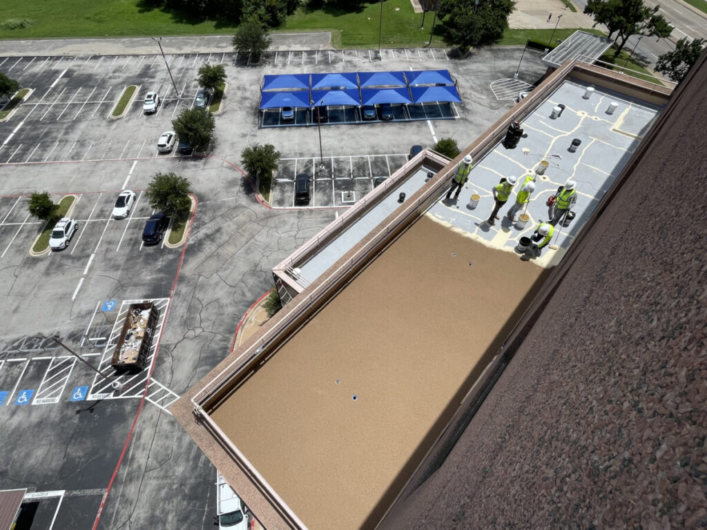 Resurfaced concrete balcony with high-solids silicone coating and ceramic granules on Arlington high-rise by Pepper Coatings
