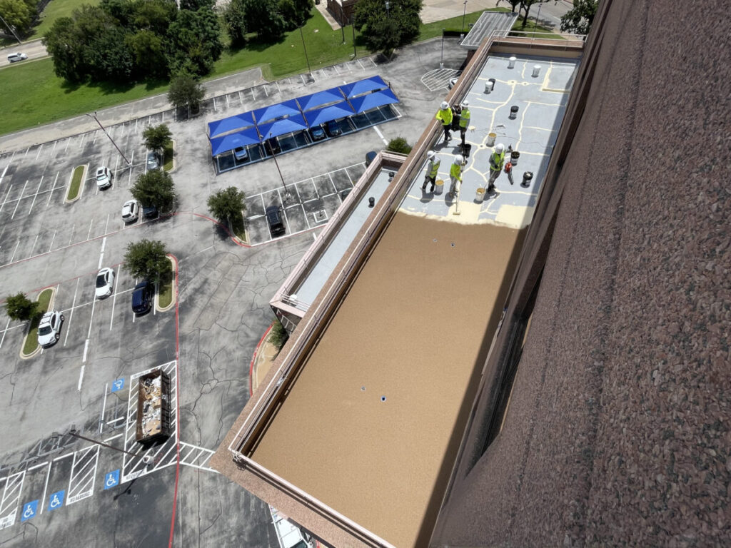 Resurfaced concrete balcony with high-solids silicone coating and ceramic granules on Arlington high-rise by Pepper Coatings
