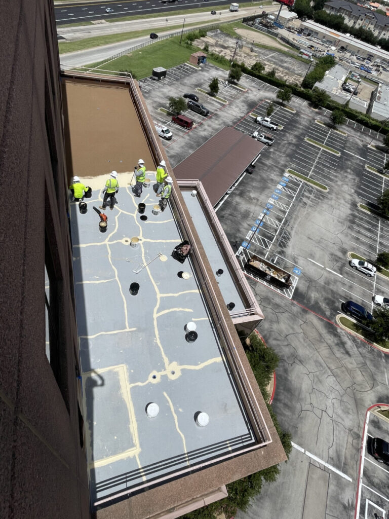 Resurfaced concrete balcony with high-solids silicone coating and ceramic granules on Arlington high-rise by Pepper Coatings