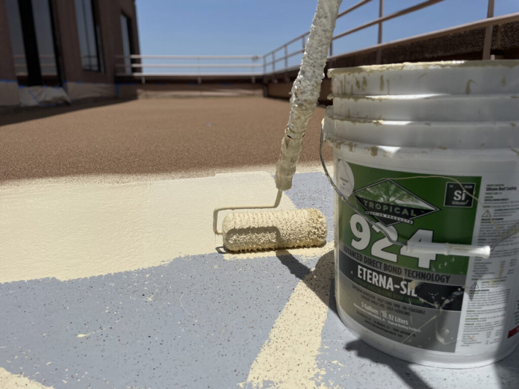 Resurfaced concrete balcony with high-solids silicone coating and ceramic granules on Arlington high-rise by Pepper Coatings