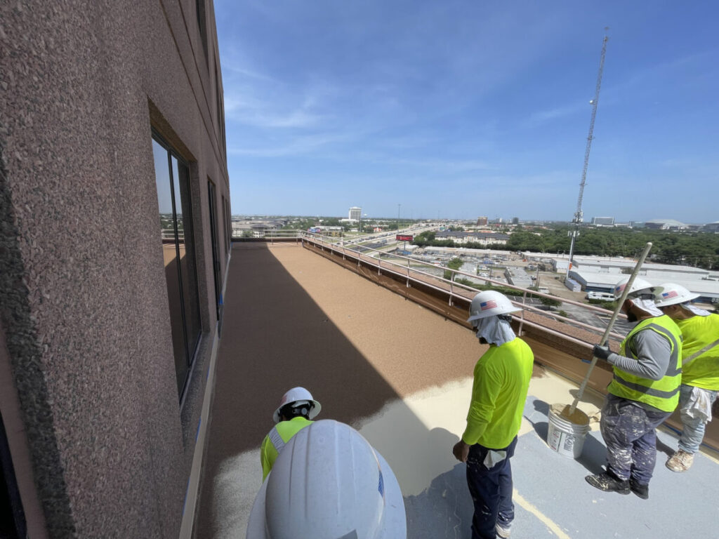 Resurfaced concrete balcony with high-solids silicone coating and ceramic granules on Arlington high-rise by Pepper Coatings