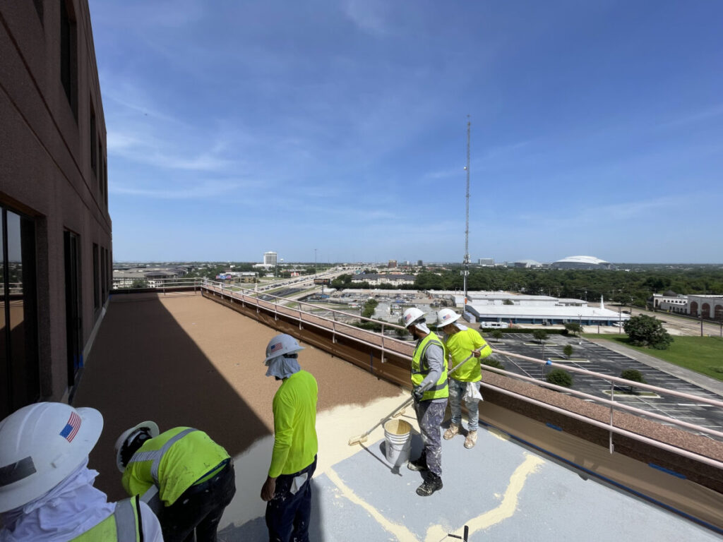 Resurfaced concrete balcony with high-solids silicone coating and ceramic granules on Arlington high-rise by Pepper Coatings