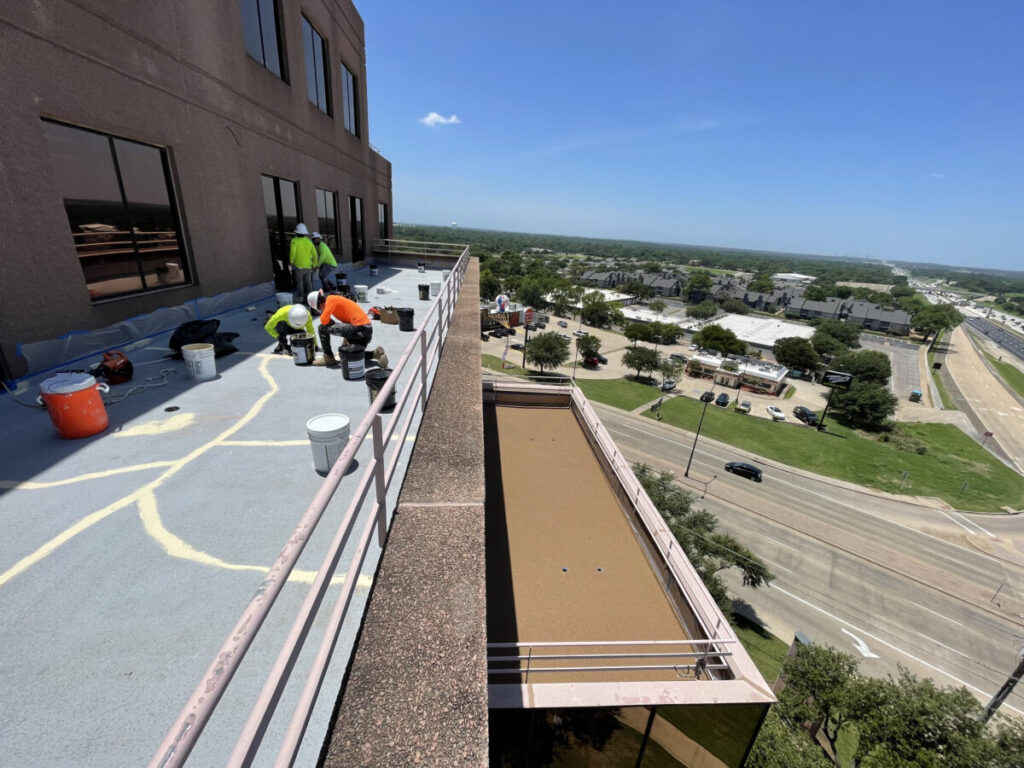 Resurfaced concrete balcony with high-solids silicone coating and ceramic granules on Arlington high-rise by Pepper Coatings
