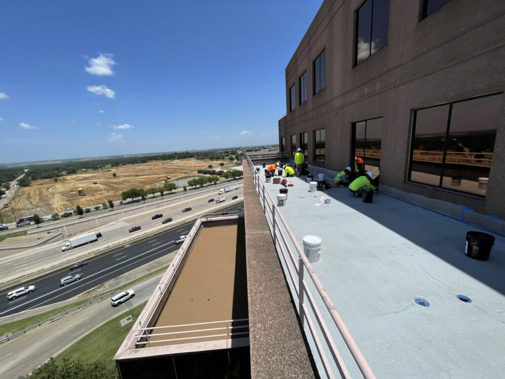 Resurfaced concrete balcony with high-solids silicone coating and ceramic granules on Arlington high-rise by Pepper Coatings
