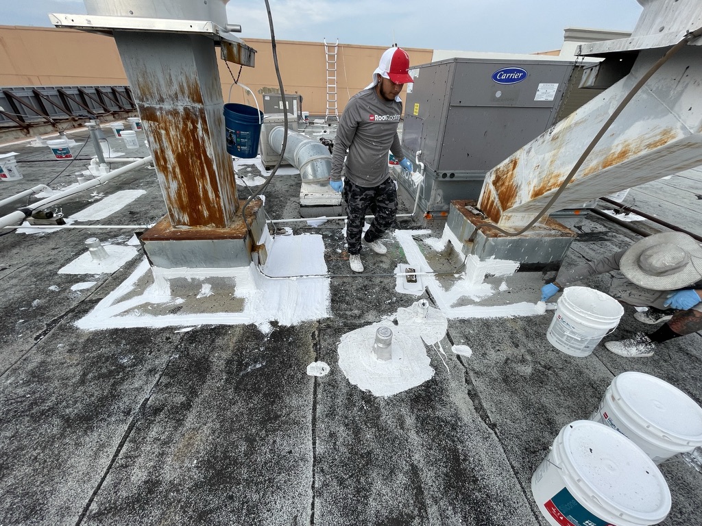 Roof coating detail work at penetrations and seams by the Pepper Coatings in-house team