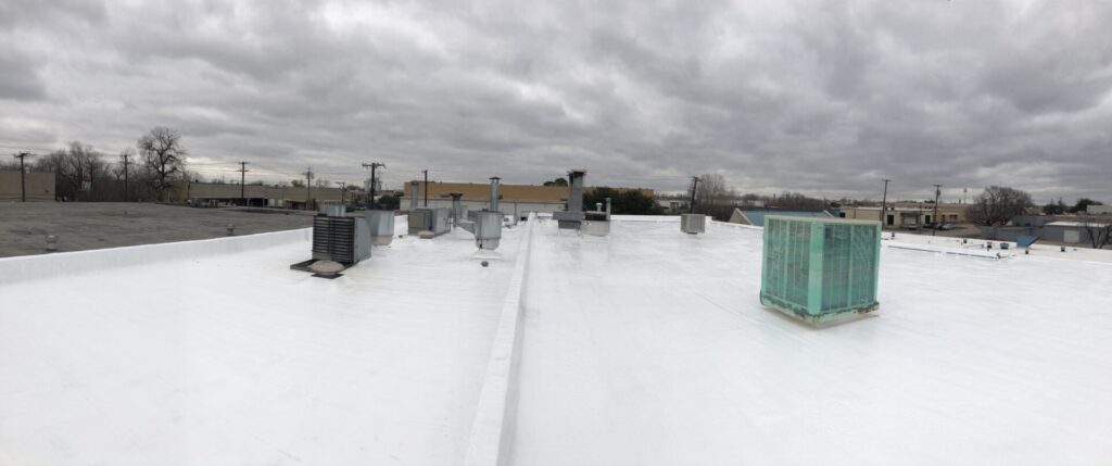 Completed white silicone roof coating, installed 2021 and still in service, 2606 Freewood Dr, Dallas