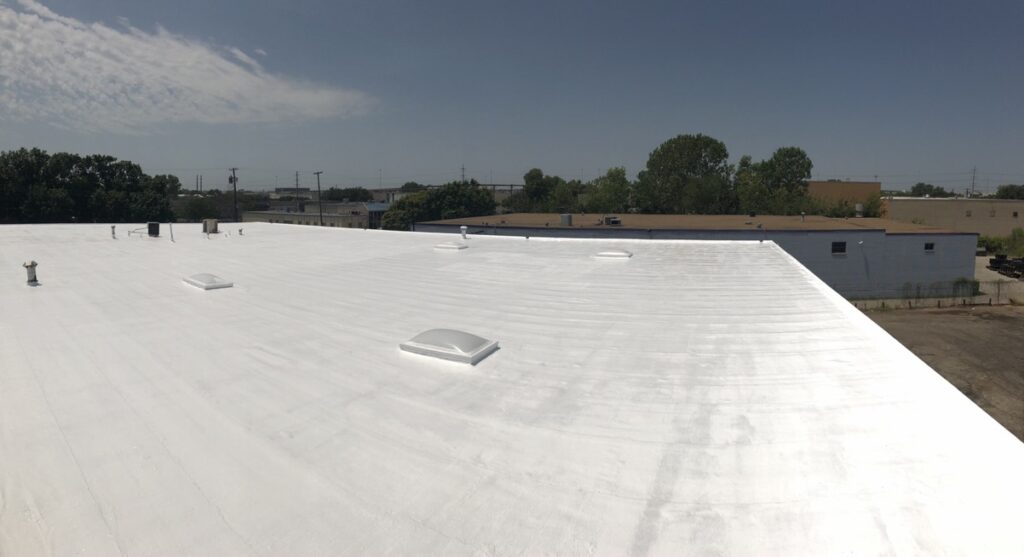 Silicone roof coating applied over the existing Mod-Bit roof at Freewood Dr and Harry Hines Blvd