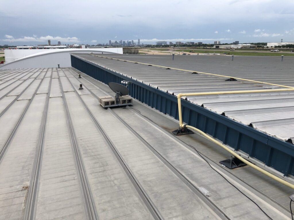 Failed fastener heads identified during roof leak detection on the hangar roof, Dallas, TX