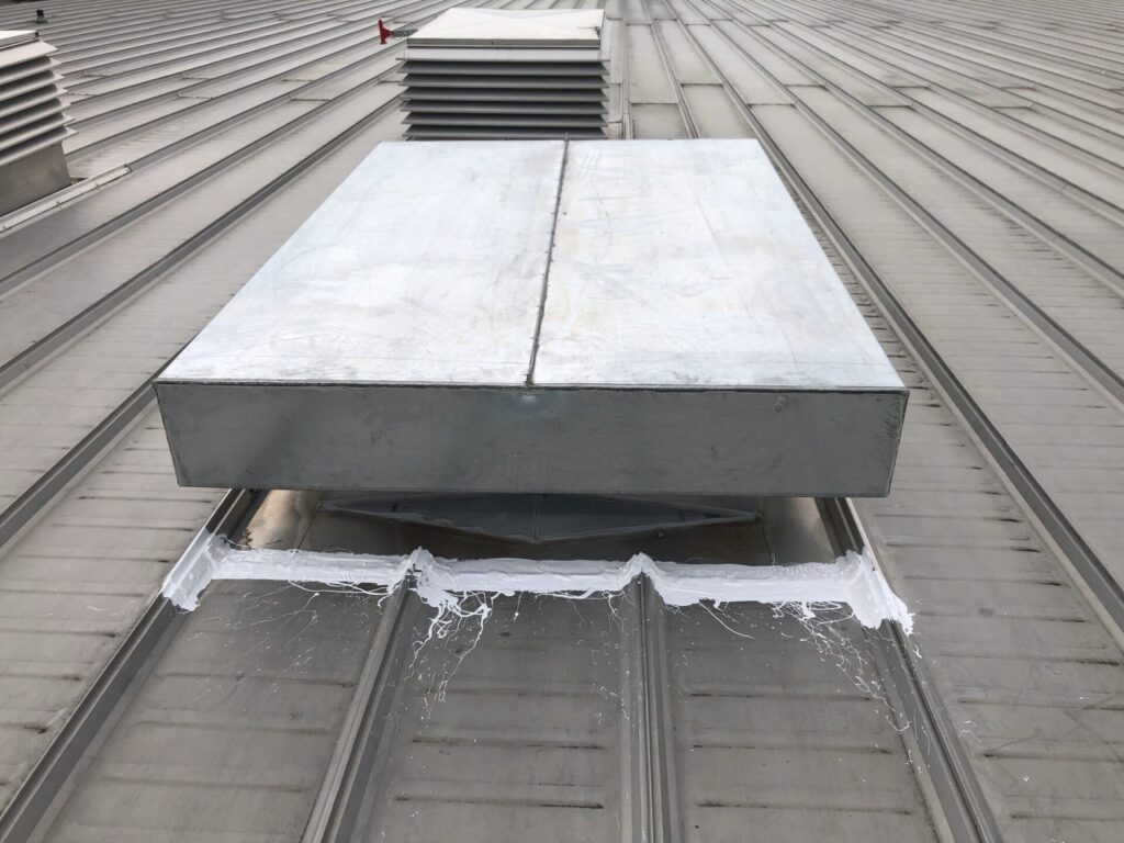 Penetration boot for a radio communication antenna sealed with silicone roof coating, Weiss St, Dallas