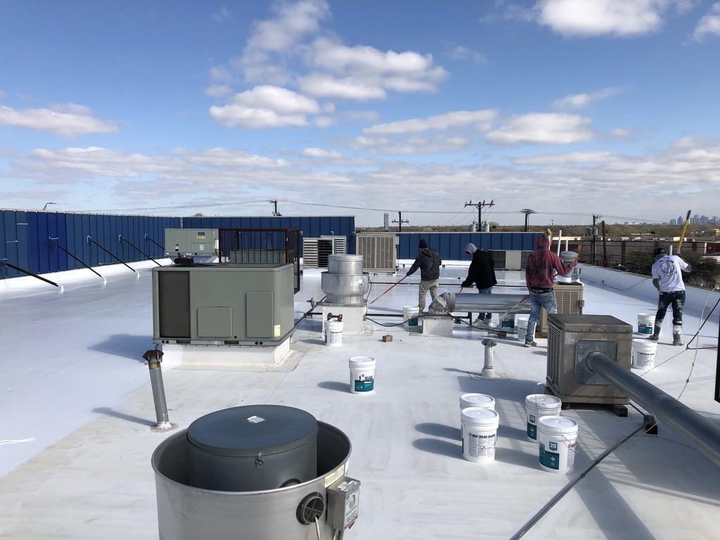 Commercial flat roof restoration in progress on the 10,000 sq ft retail strip center, South Dallas