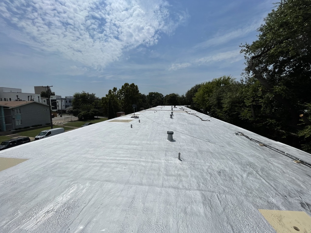 Reflective finished roof coating over the restored bitumen roofing system, Monarch St, Dallas, TX