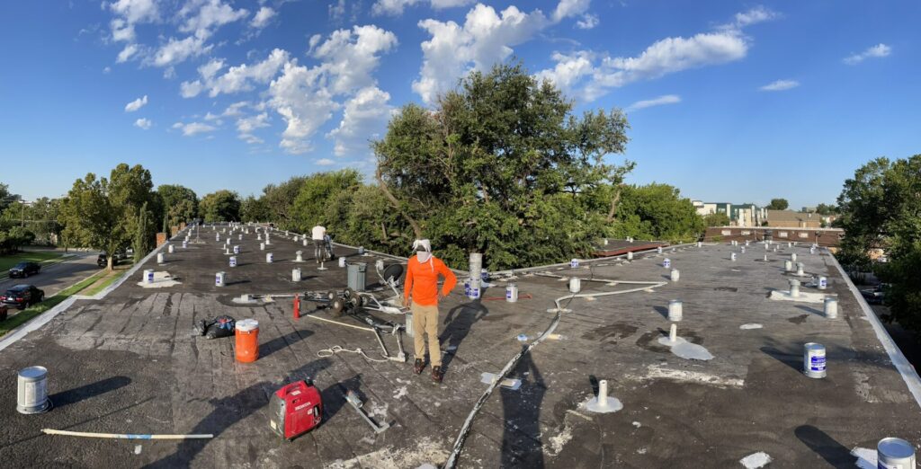 Roof drains and curbs sealed during prep on the Dallas multifamily roof restoration