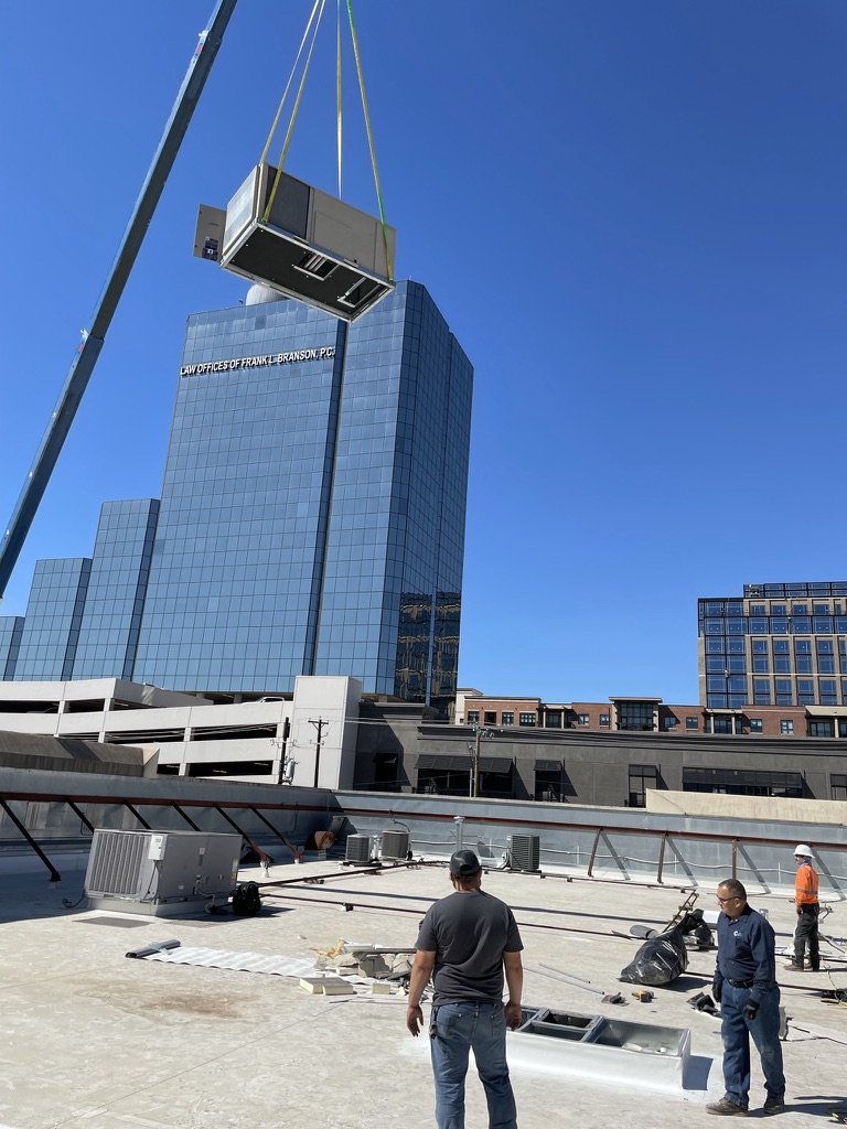 Cutting through the TPO membrane, lightweight concrete, and metal roof pan on McKinney Ave, Dallas