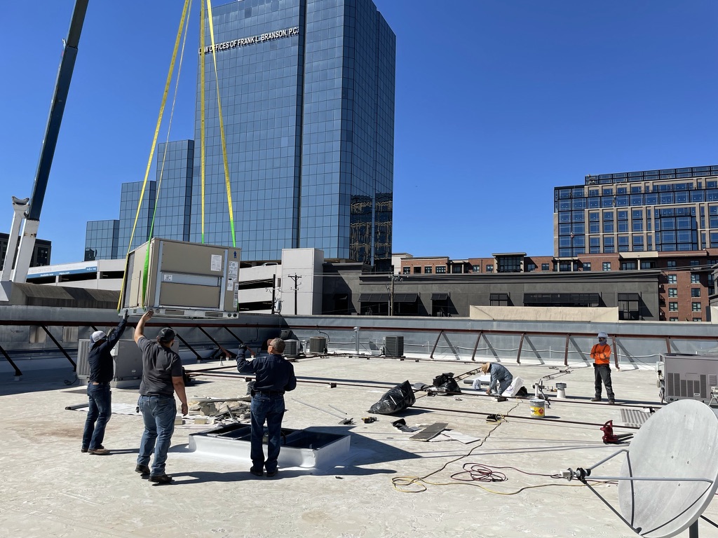 New 4x8 foot metal RTU curb set and secured to the roof assembly in Uptown Dallas, Texas