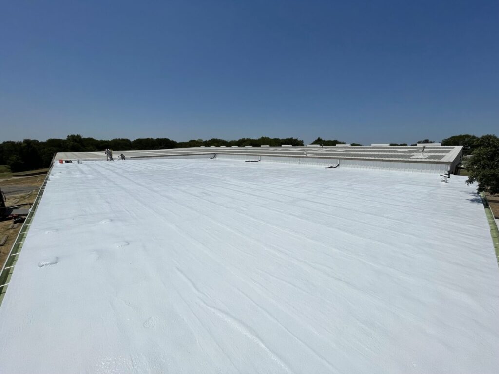 Completed silicone roof coating at 2407 N Preston St near Highway 287 and Interstate 45, Ennis, Texas