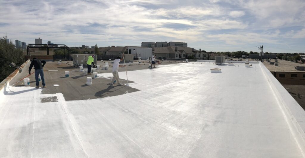 White silicone roof coating application between downtown Fort Worth and the Historic Cultural District