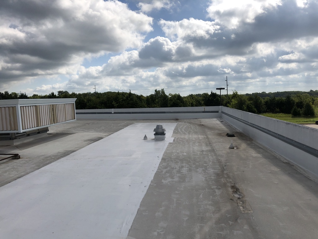 TPO roof with silicone coating repairs at the Circo Enterprises property in Greenville Air Park
