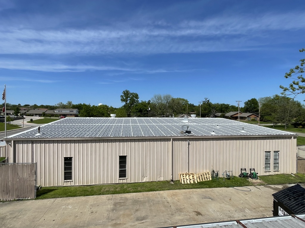 Commercial metal R-panel roof repair with silicone mastic at 4609 King St., Greenville, TX