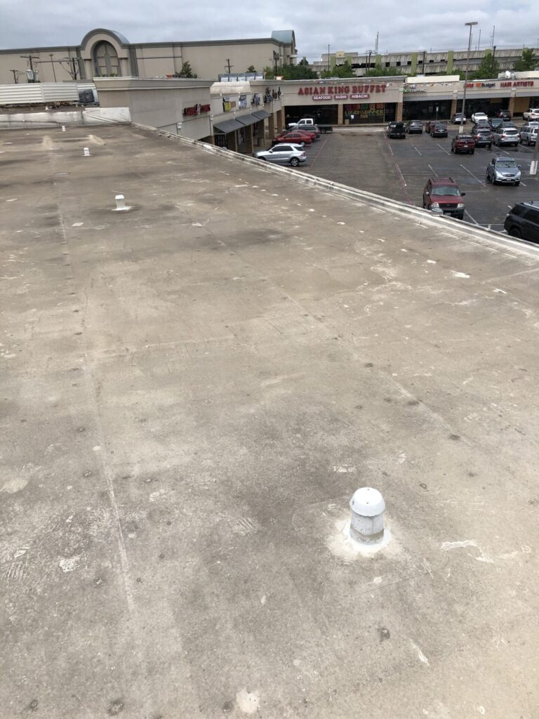 Commercial flat roof repair with silicone coating at Melbourne Place strip center, Hurst, TX