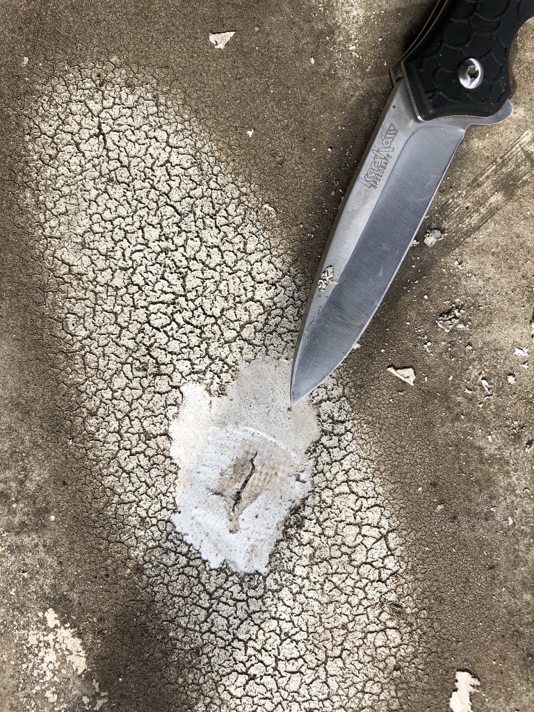 Silicone mastic applied to flat roof seams at Melbourne Place, 945 Melbourne Rd, Hurst, Texas
