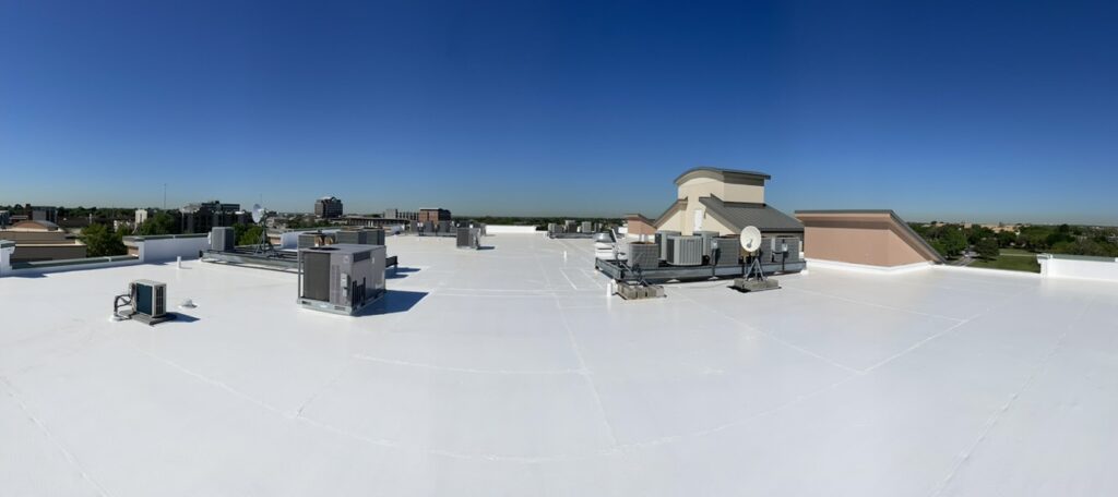 Finished bright white silicone roof coating system at Saint Camillus Medical Center, 809 W Harwood Rd, Hurst