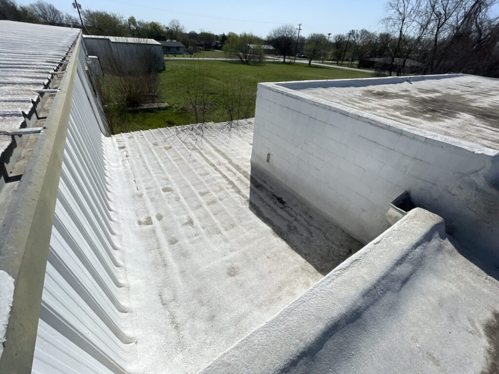 Commercial flat roof restoration in progress across from the Kohl's Distribution Center, Lancaster, TX