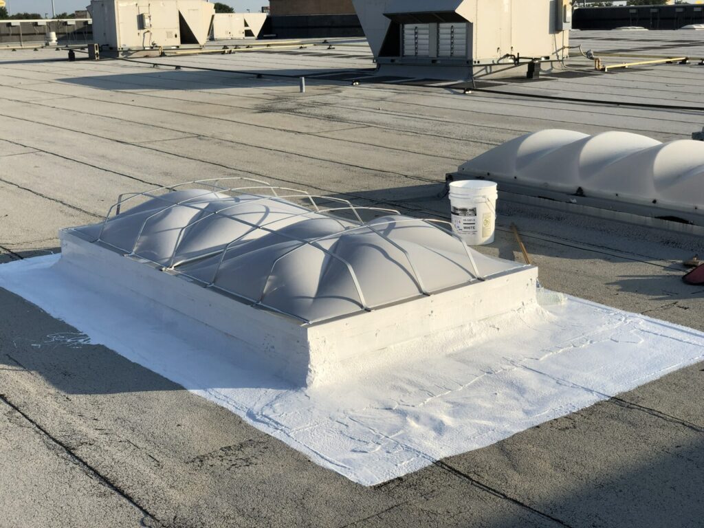 Defective skylight curb causing a roof leak over the basketball court at LA Fitness, Lewisville, TX