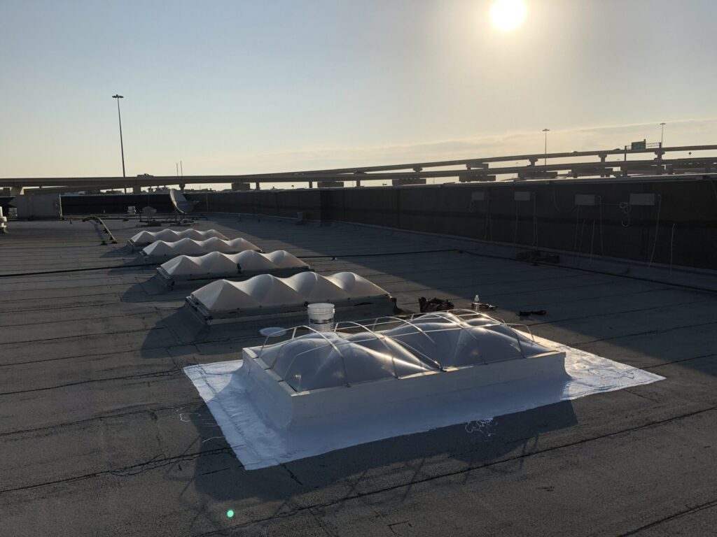 Silicone mastic sealing the skylight frame to the dome at LA Fitness near Vista Ridge Mall, Lewisville