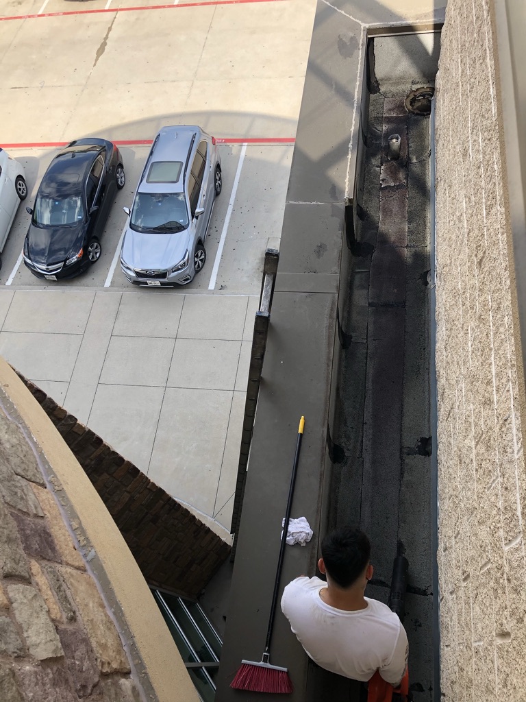 Roof granules and dirt buildup on the Modified Bitumen roof at LA Fitness, S Central Expressway, McKinney, TX
