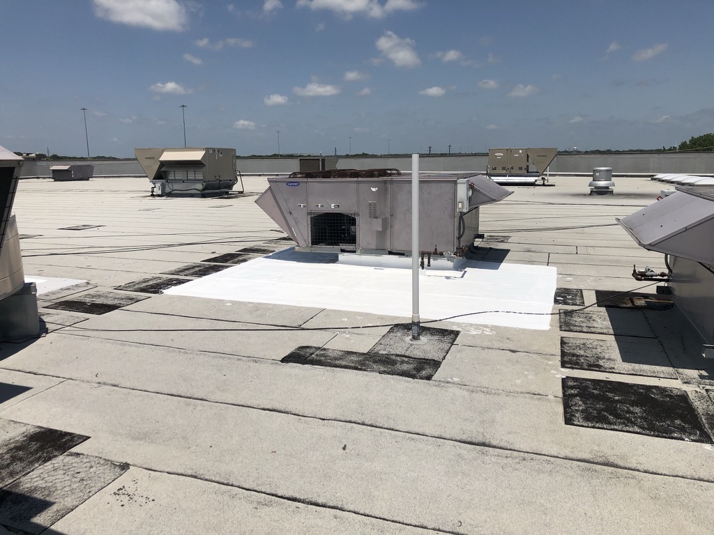 Completed silicone roof coating repair over the existing Modified Bitumen roof at LA Fitness, McKinney