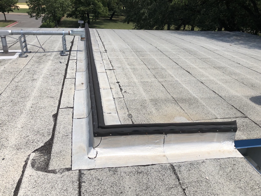 Failed EPDM expansion joint letting water into the structure at the AT&T property, 1412 W Harrison St, Melissa, TX