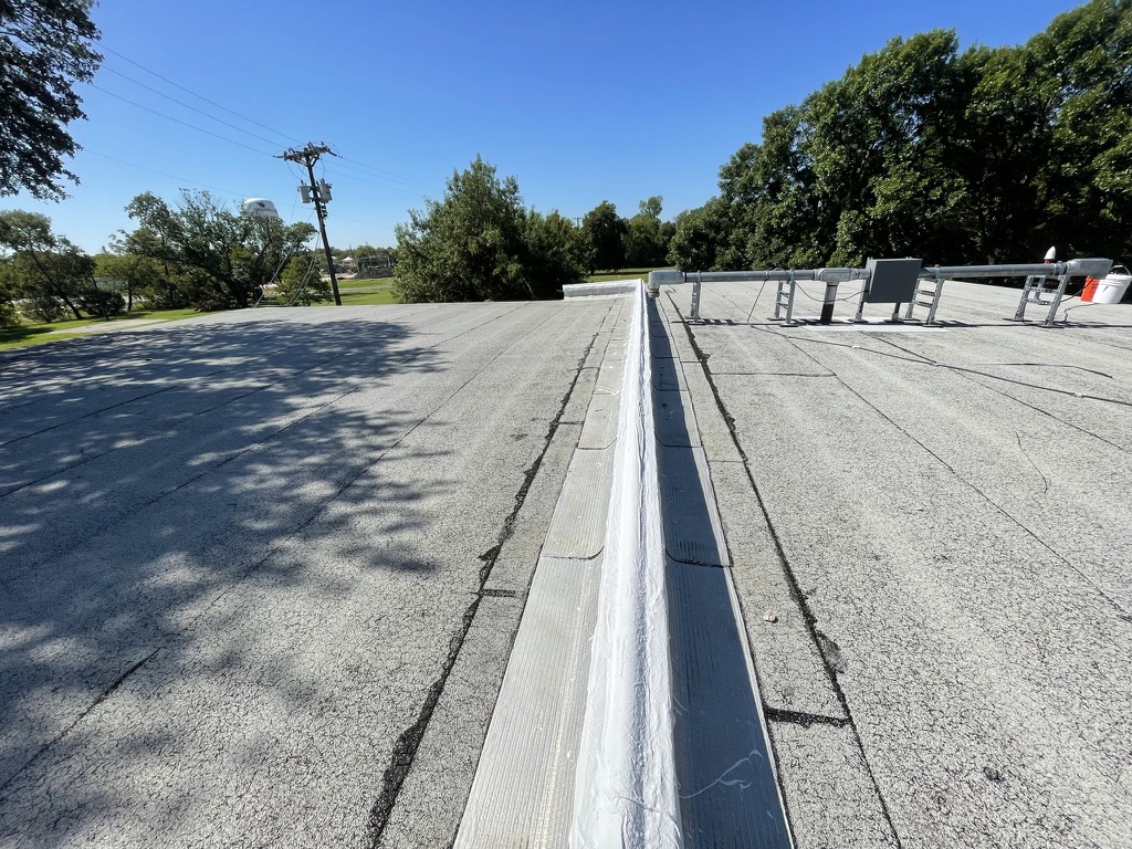 Completed expansion joint repair on the commercial Modified Bitumen roof in Old Town Melissa, TX