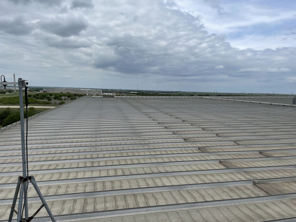 Large industrial standing-seam metal roof in Midlothian, TX during a Pepper Coatings roof inspection