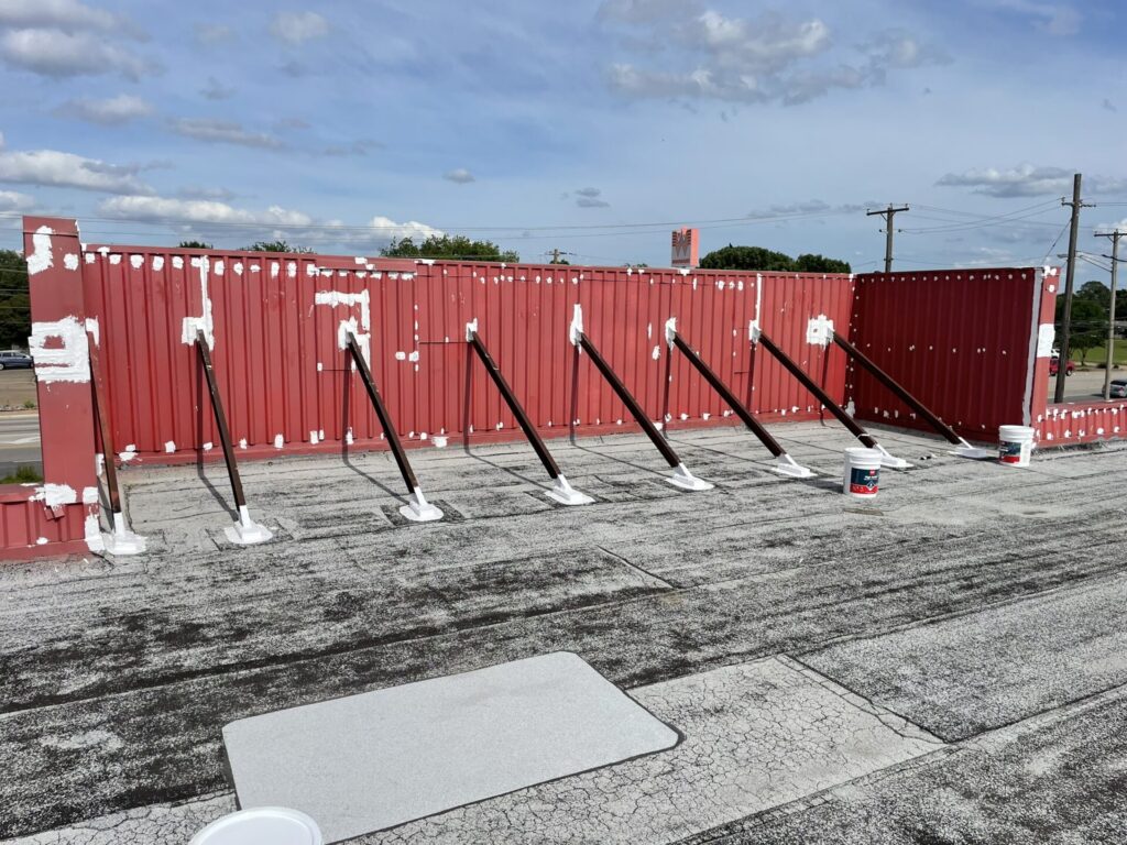 Silicone mastic detail work on penetrations and drip edge at Davis Blvd commercial property, NRH