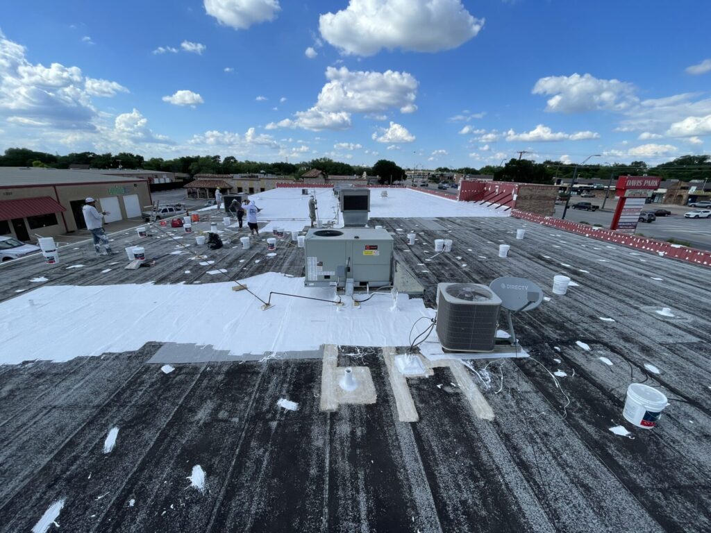 Completed elastomeric silicone roof coating over Modified Bitumen at 5025 Davis Blvd, NRH