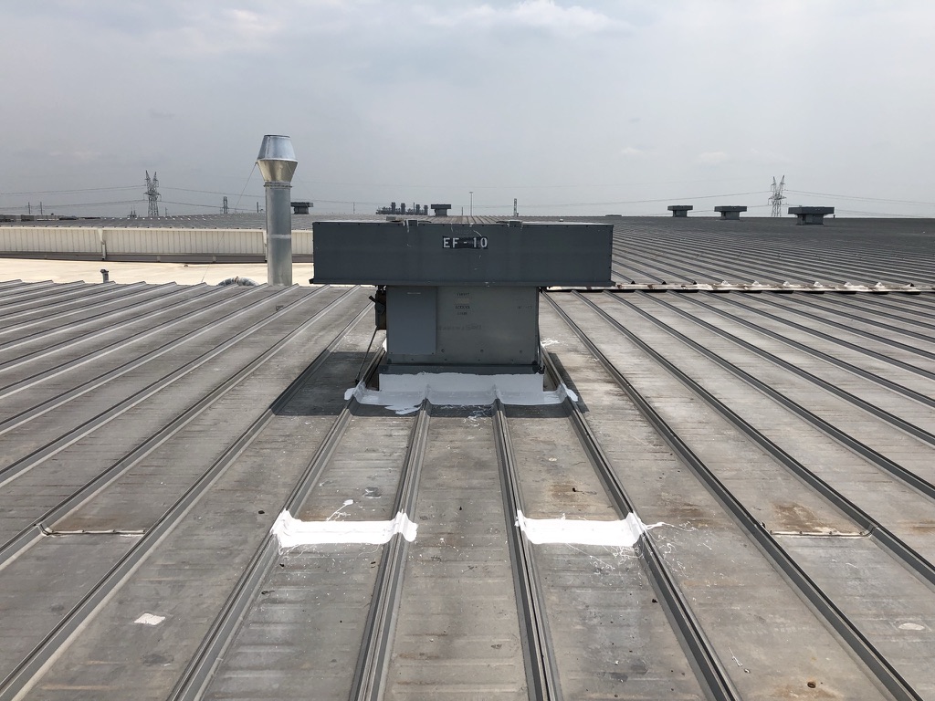 3-course silicone roof coating application over horizontal seams on the standing seam roof, Paris, Texas